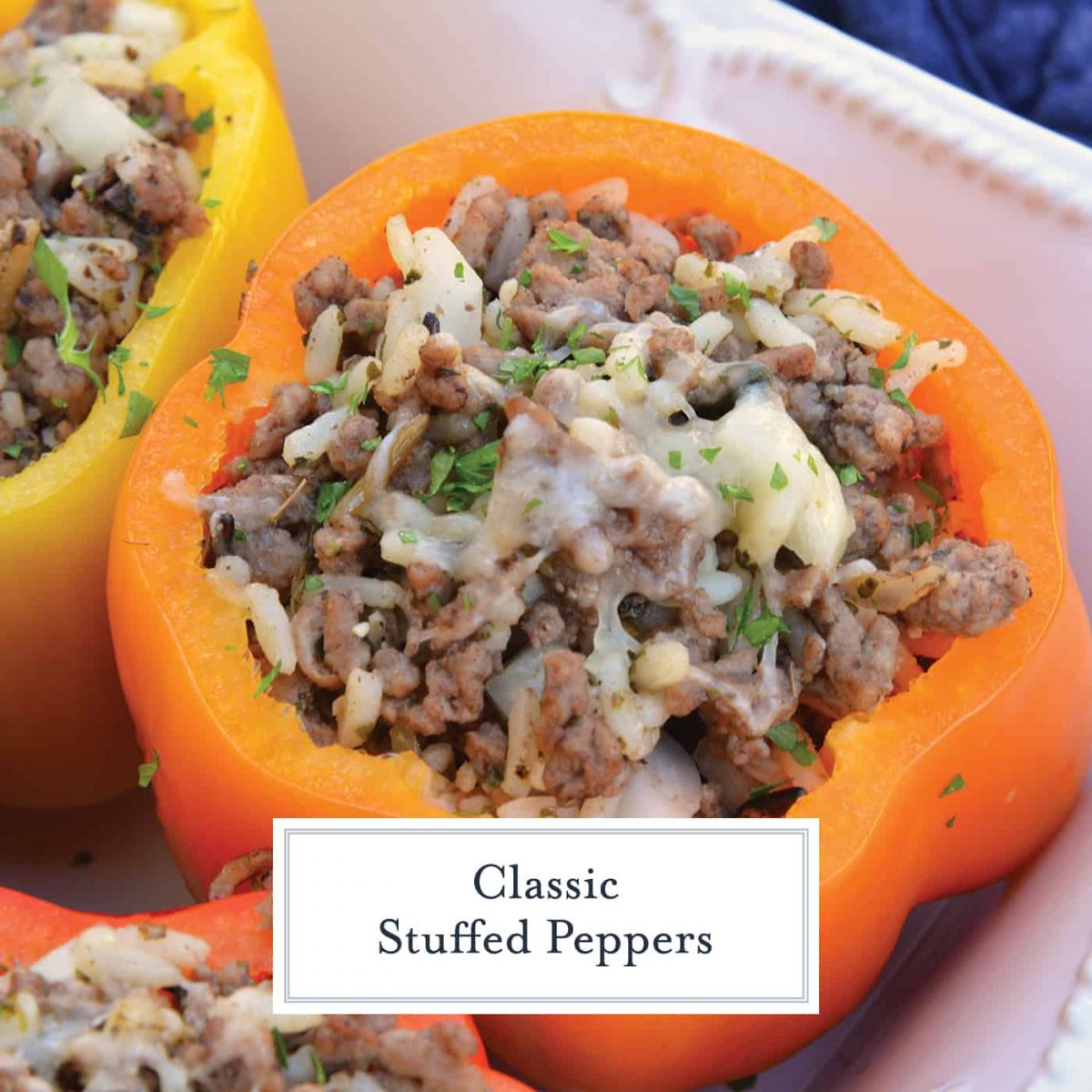 Classic Stuffed Peppers are bell peppers stuffed with ground beef, rice, cheese and spices. A timeless meal ready in 30 minutes and easily made ahead. #stuffedpeppers #stuffedbellpeppers www.savoryexperiments.com