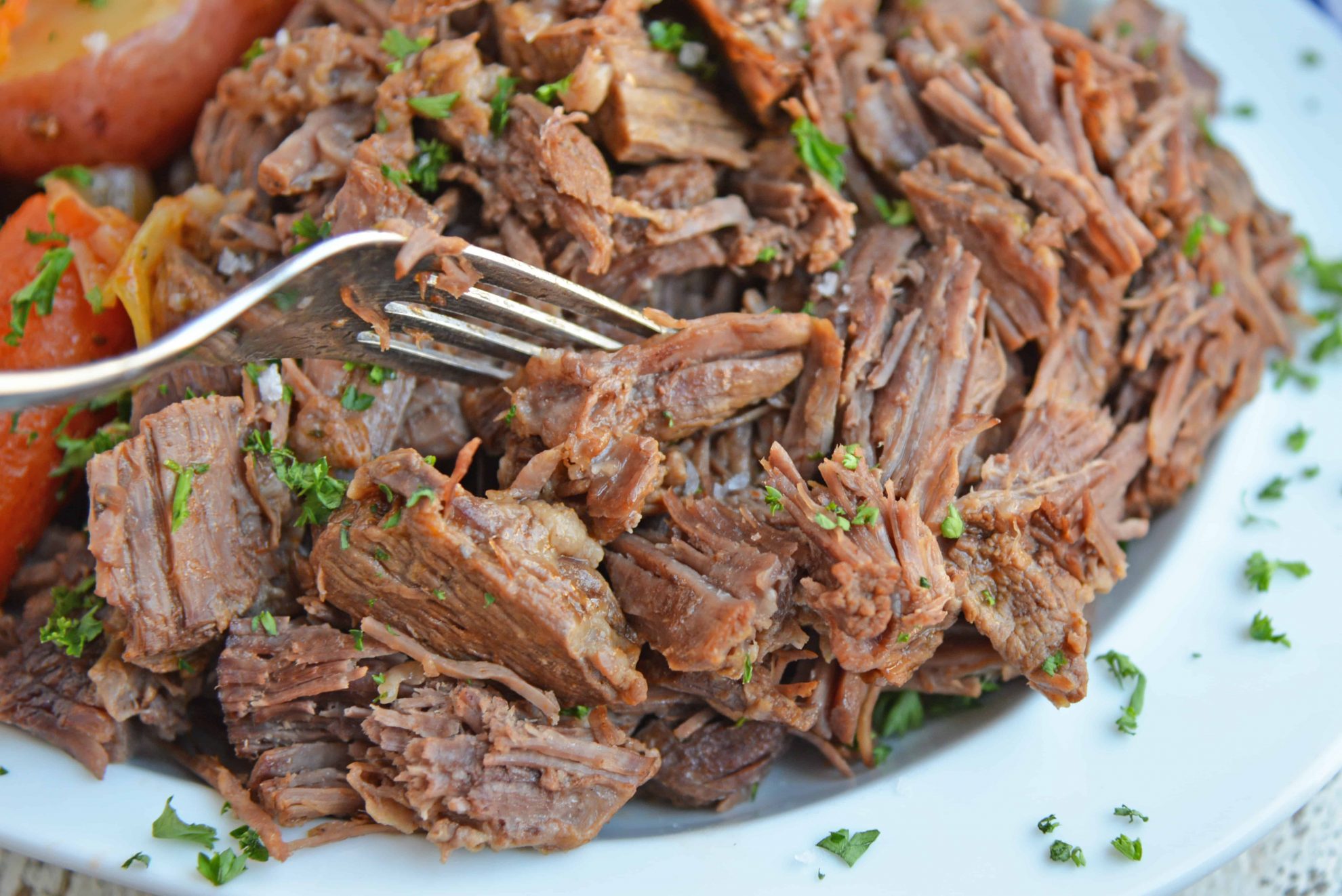 Fork shredding tender pot roast