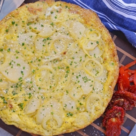 Tortilla Espanola, also known as Spanish Tortilla or Potato Tortilla, is a Spanish egg dish made with fried potatoes, onions and cheese. #tortillaespanola #spanishtortilla #potatotortilla www.savoryexperiments.com