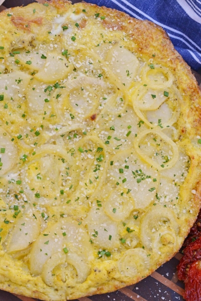 Tortilla Espanola, also known as Spanish Tortilla or Potato Tortilla, is a Spanish egg dish made with fried potatoes, onions and cheese. #tortillaespanola #spanishtortilla #potatotortilla www.savoryexperiments.com