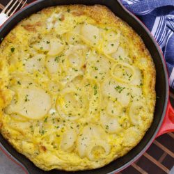 Tortilla Espanola, also known as Spanish Tortilla or Potato Tortilla, is a Spanish egg dish made with fried potatoes, onions and cheese. #tortillaespanola #spanishtortilla #potatotortilla www.savoryexperiments.com