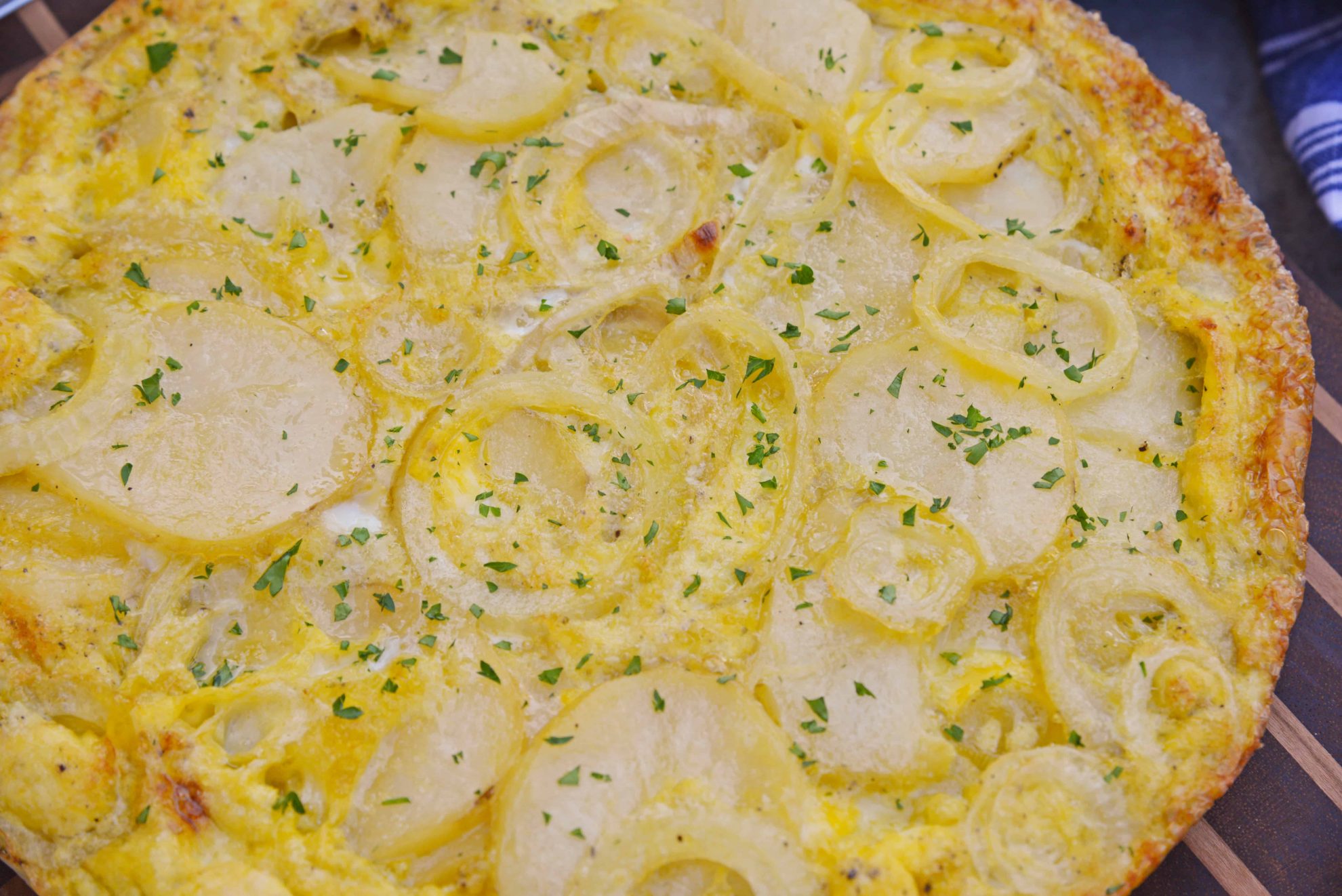 Tortilla Espanola, also known as Spanish Tortilla or Potato Tortilla, is a Spanish egg dish made with fried potatoes, onions and cheese. #tortillaespanola #spanishtortilla #potatotortilla www.savoryexperiments.com 