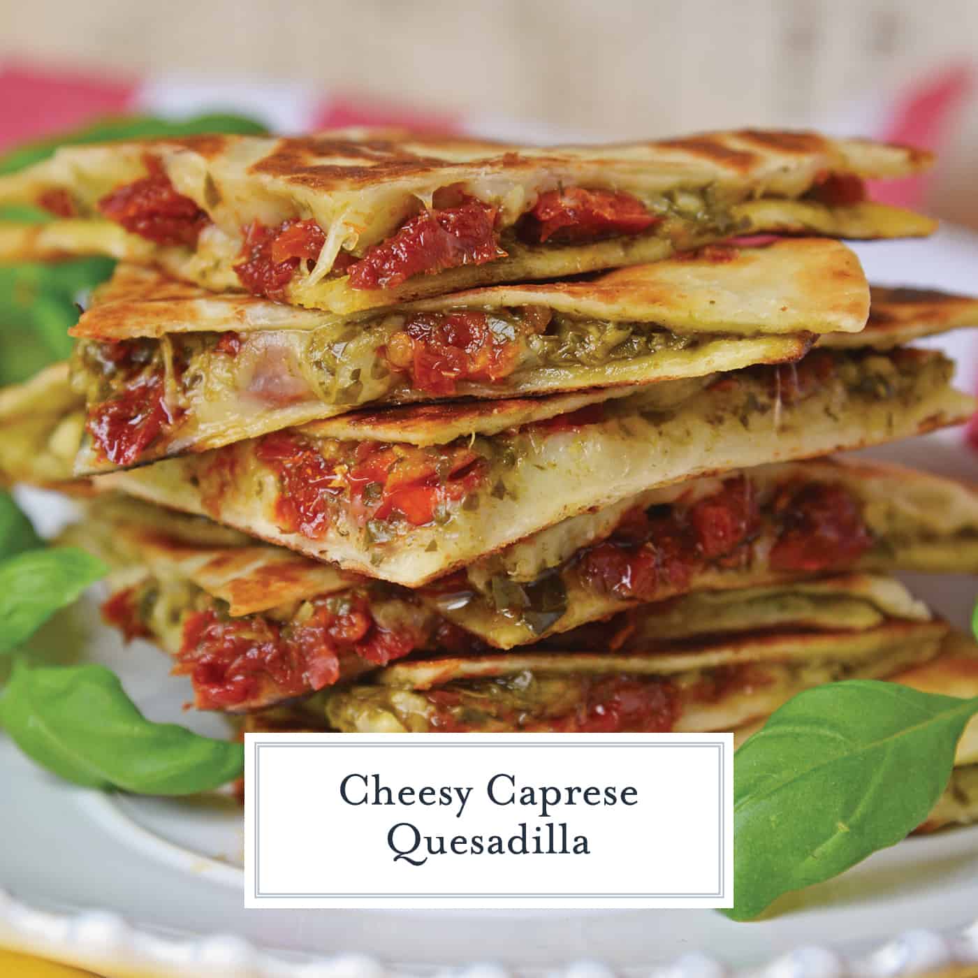 Caprese Quesadillas combine homemade pesto sauce with sun dried tomatoes and gooey mozzarella cheese. Serve for lunch, dinner or even as a party appetizer! #quesadillarecipe #capresequesadilla www.savoryexperiments.com 