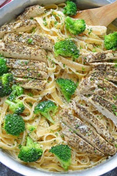 Broccoli chicken Alfredo in a stainless steel skillet