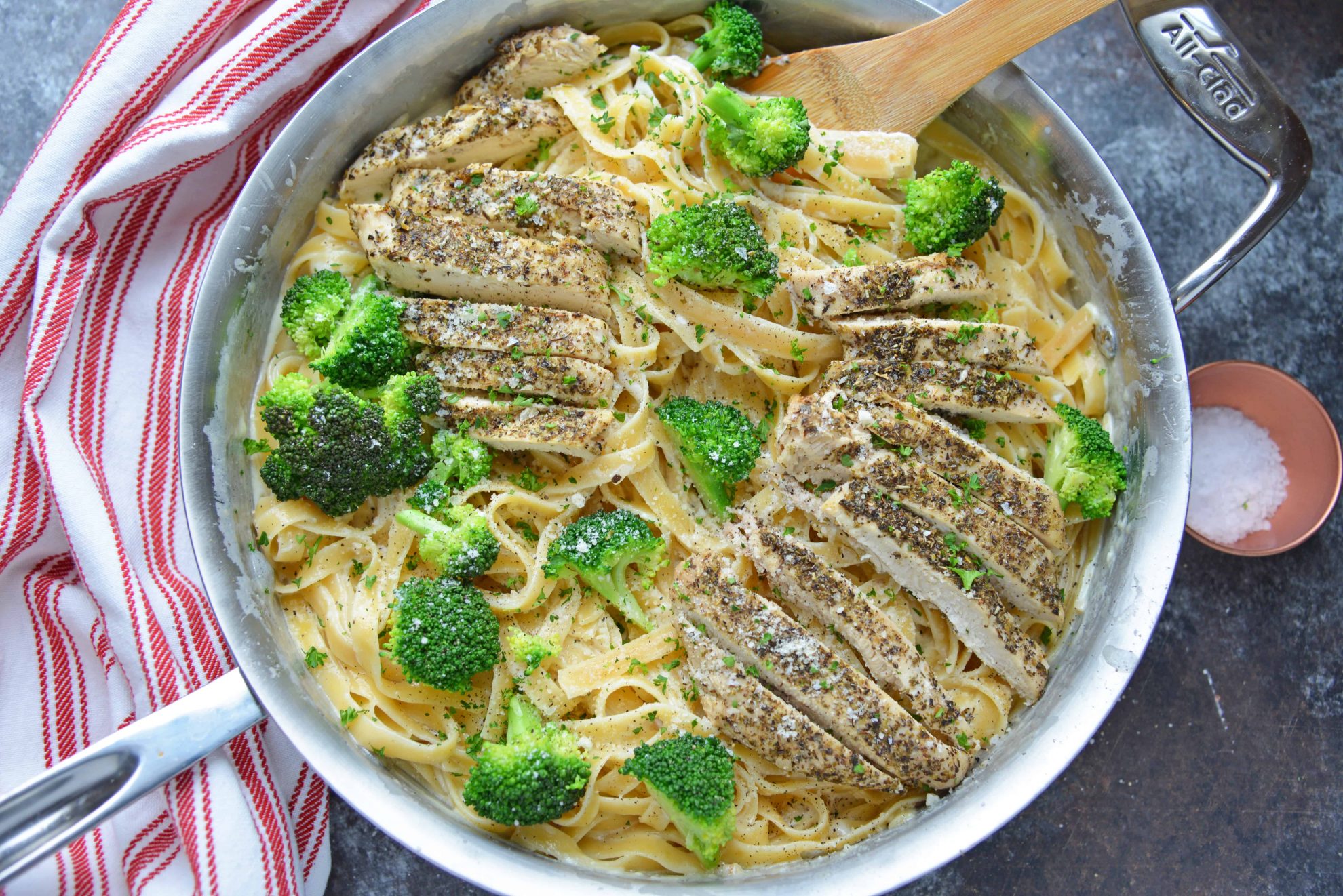 Broccoli chicken Alfredo in a stainless steel skillet