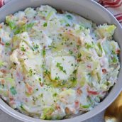 Overhead of colcannon in a bowl and topped with butter