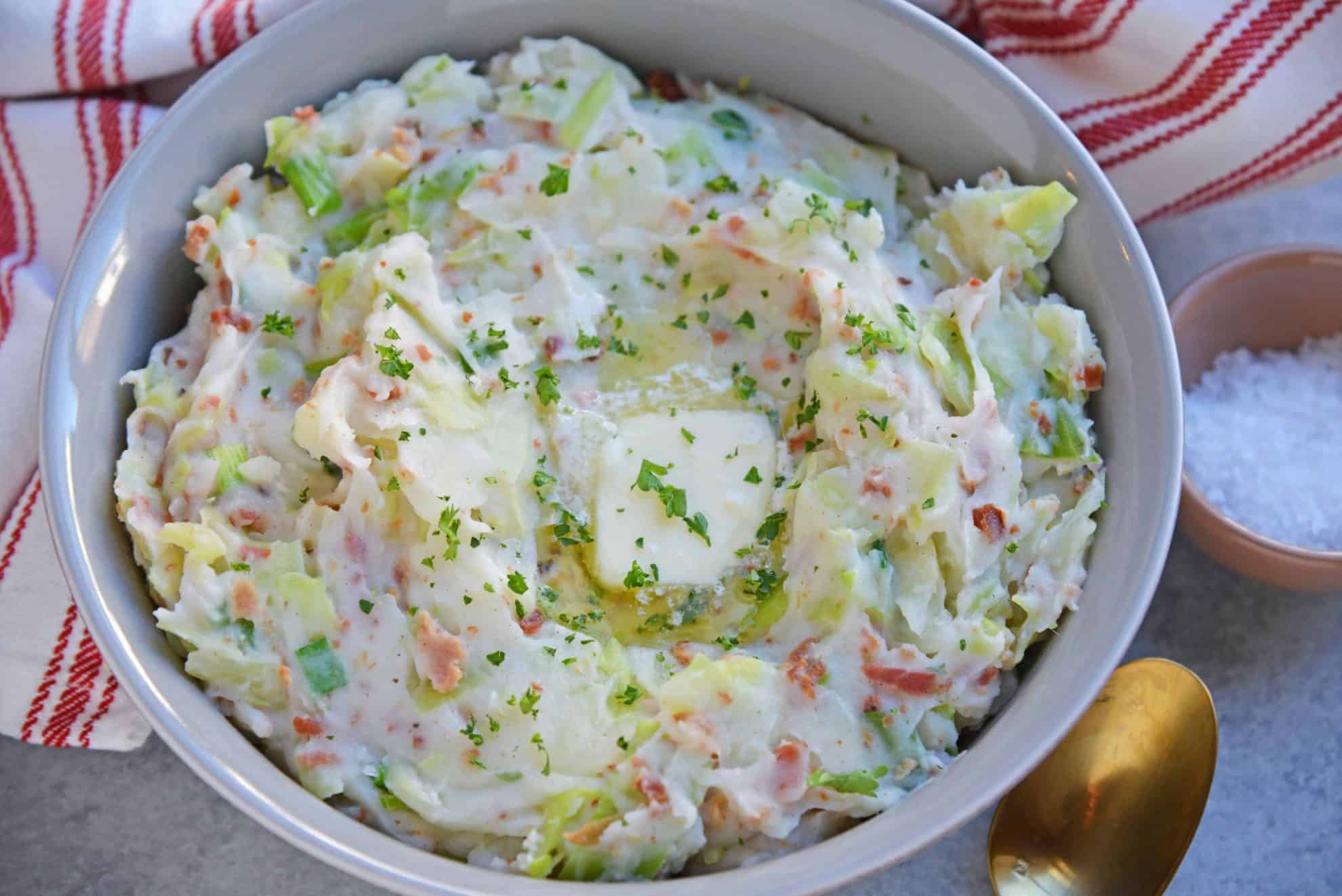Overhead of colcannon in a bowl and topped with butter