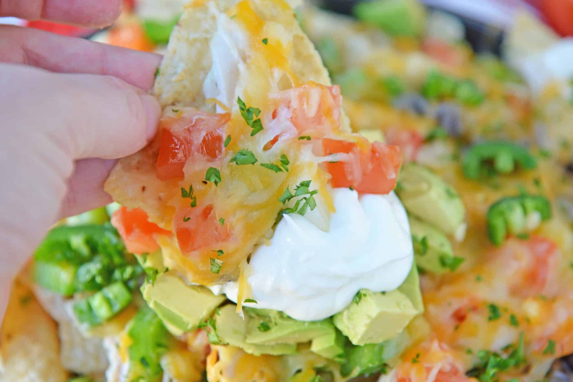 Close up of nacho with yogurt topping