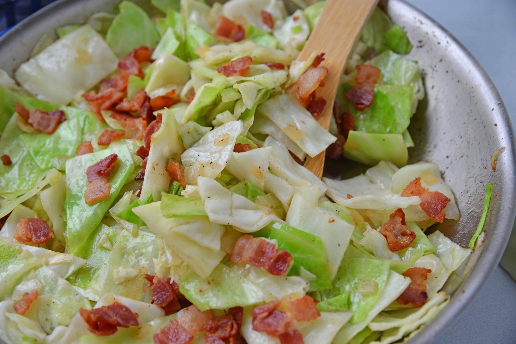 Fried Cabbage with bacon in skillet