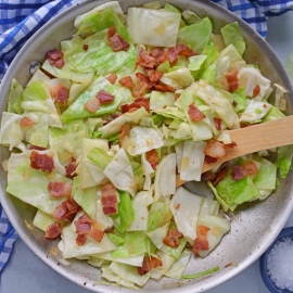 Fried Cabbage with Bacon in a Skillet