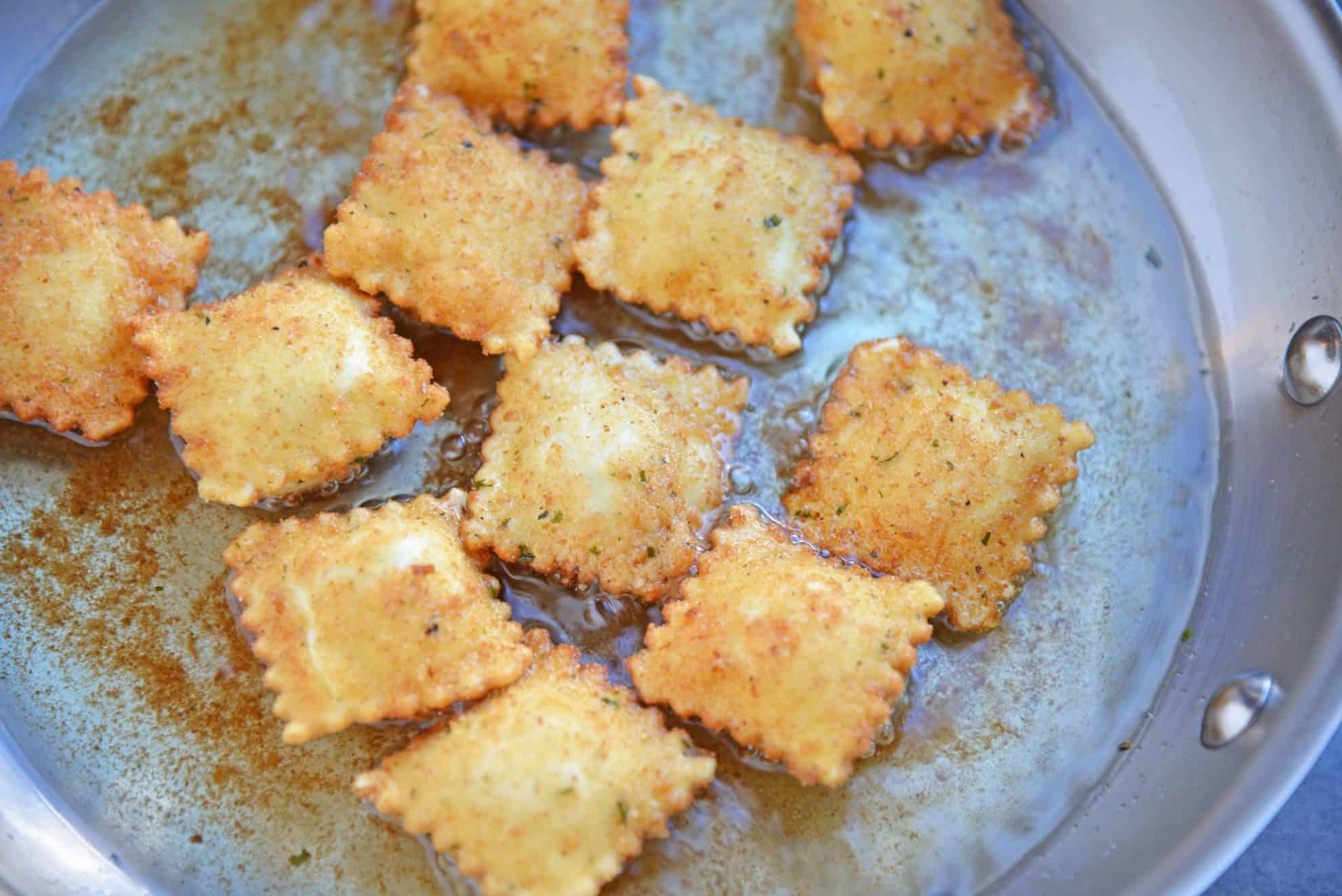 Breaded Ravioli in a stainless steel frying pan