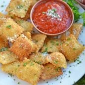 Cheesy Fried Ravioli on a white serving platter