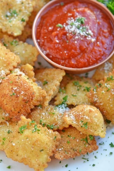 Cheesy Fried Ravioli on a white serving platter