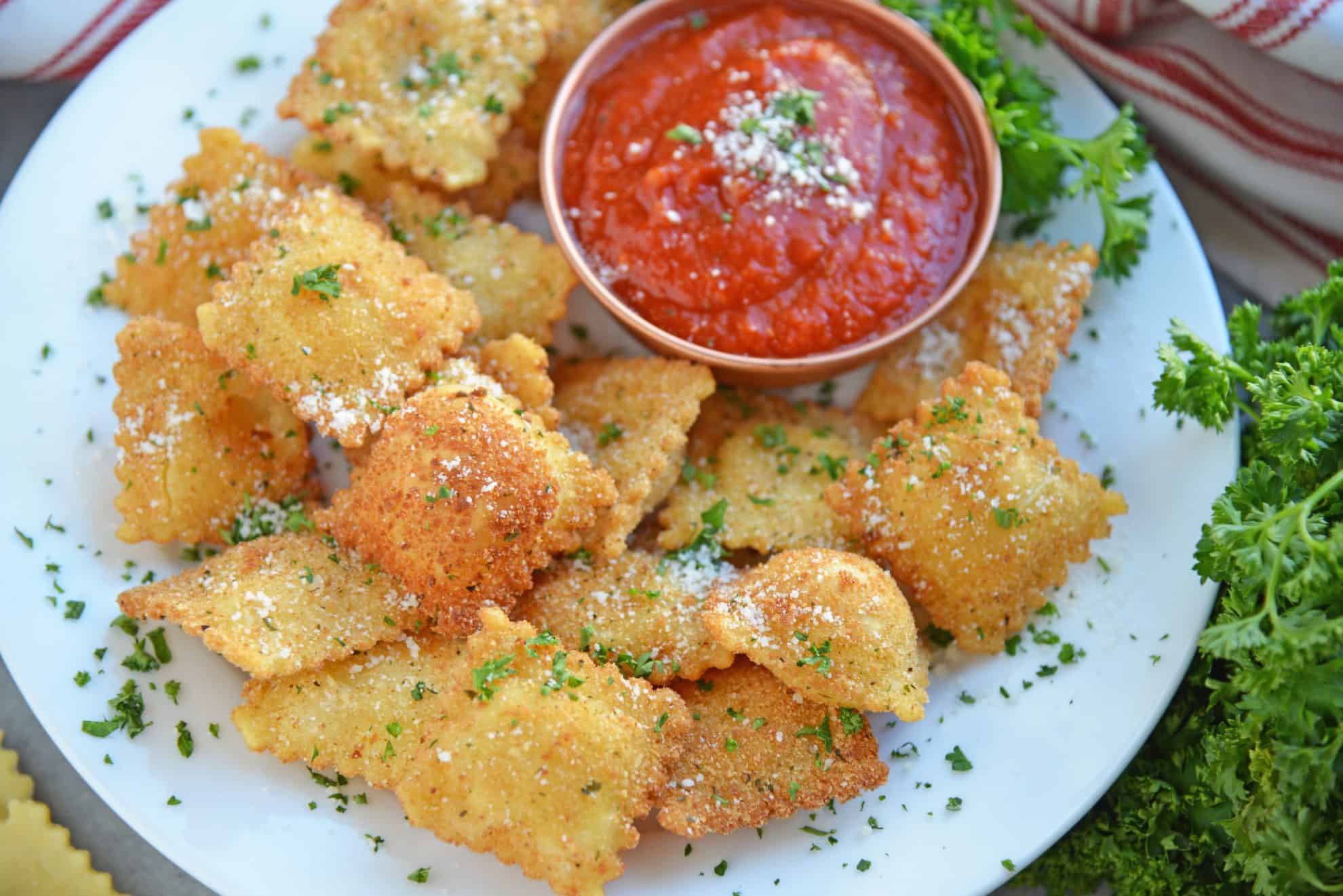 Cheesy Fried Ravioli on a white serving platter