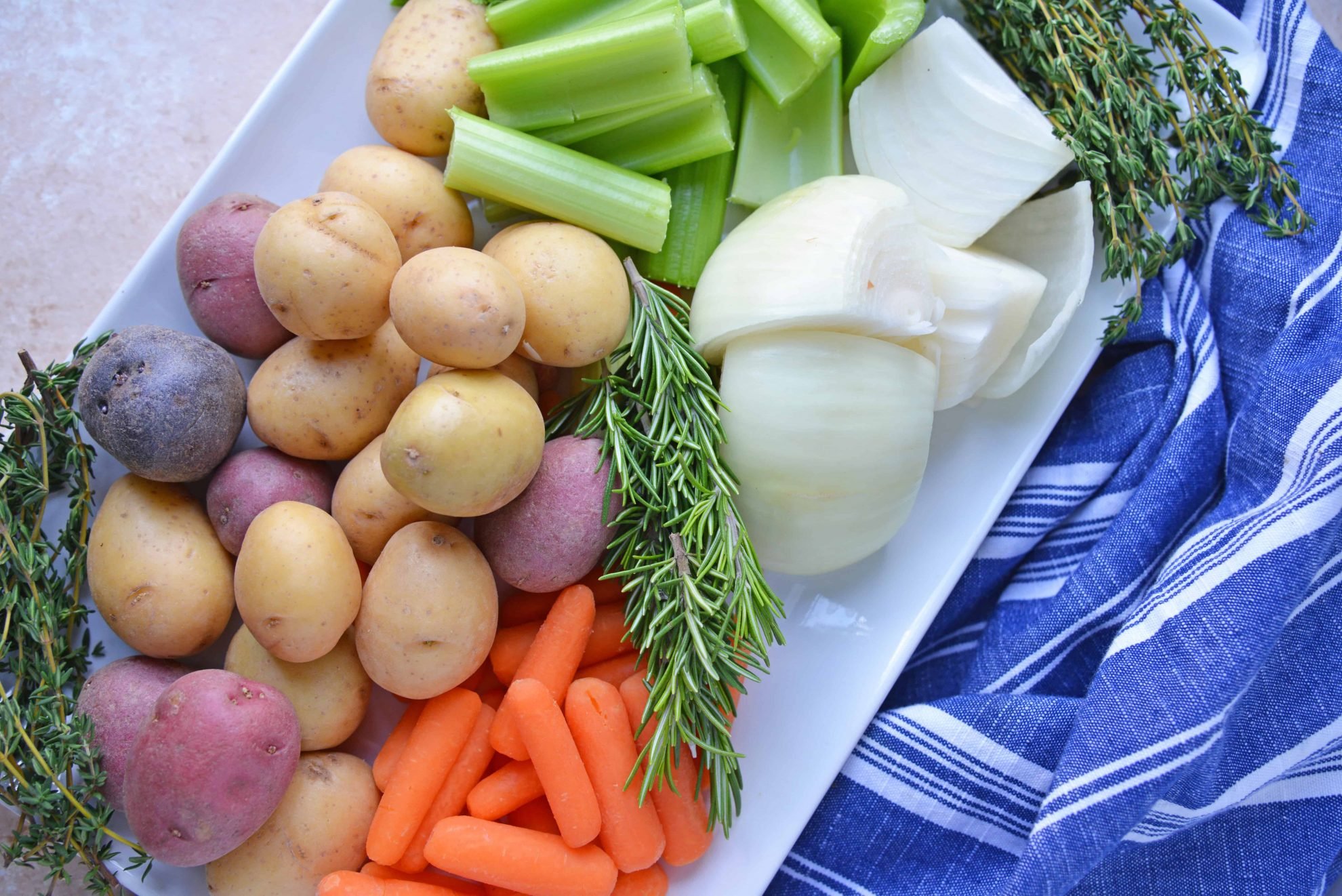 Platter of raw vegetables with blue napkin