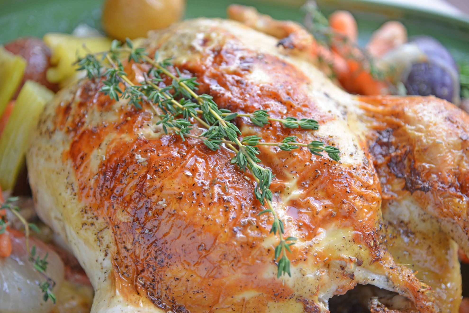 close up of roast chicken with thyme