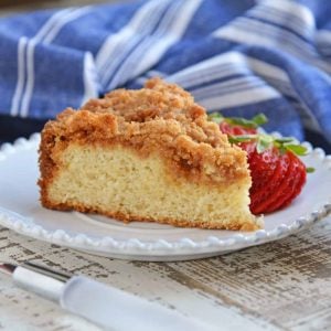 Side view of a coffee cake with sliced strawberries