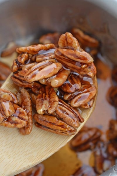 Pecan Caramel Sauce on a wooden spoon