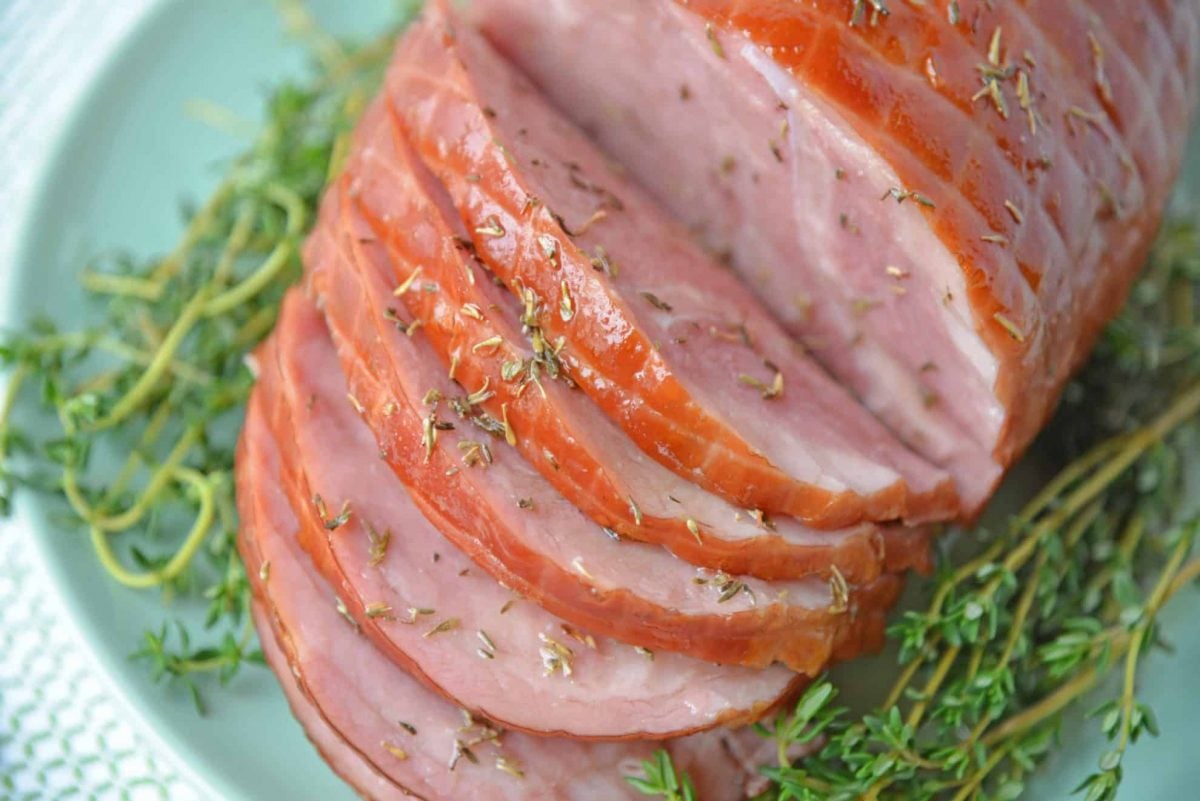 A plate of food with a slice cut out, with Ham and Thyme
