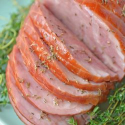 A plate of food with a slice cut out, with Ham and Thyme