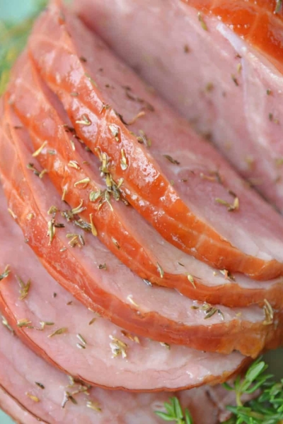 A plate of food with a slice cut out, with Ham and Thyme