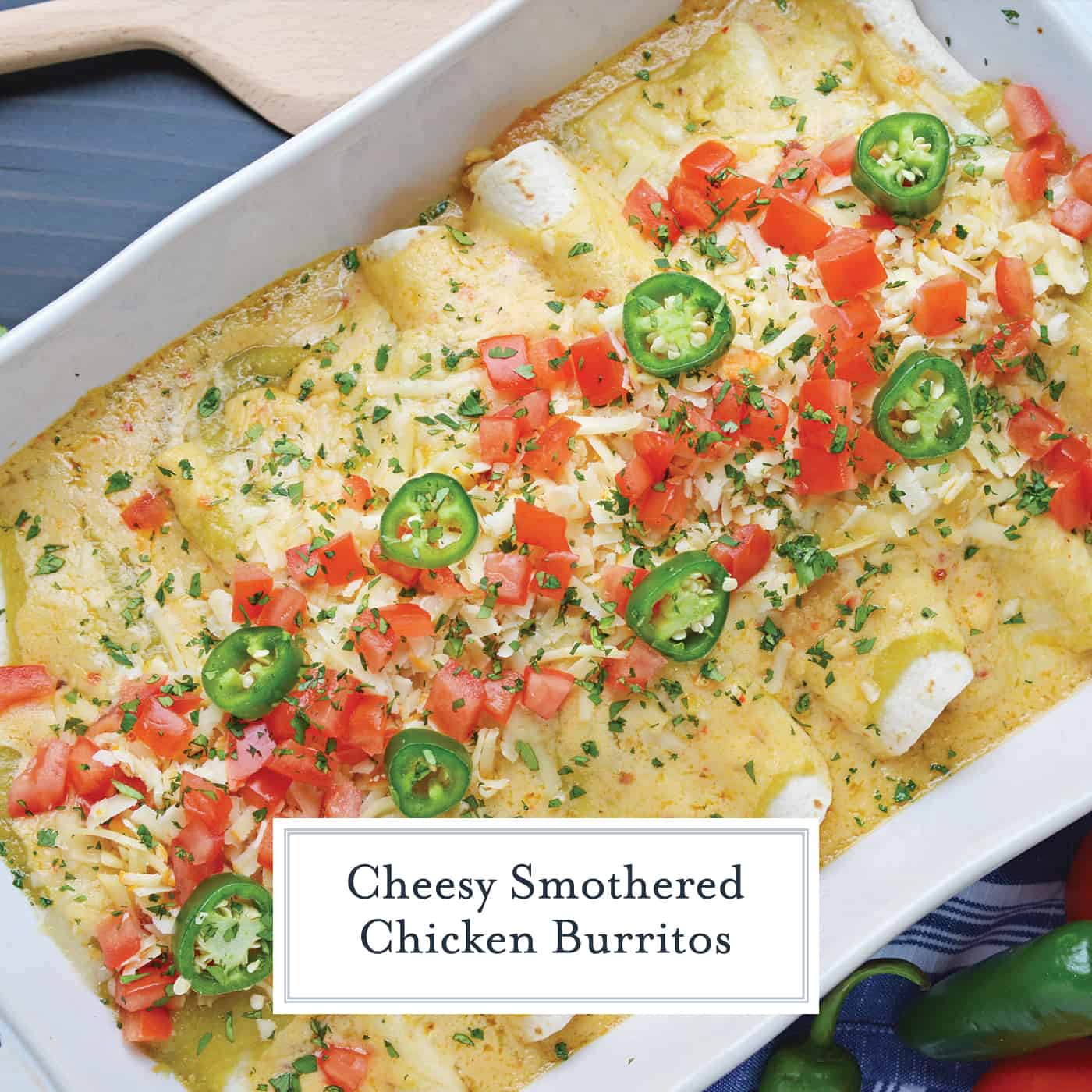 overhead of chicken burritos with cheese, tomatoes and jalapeno 