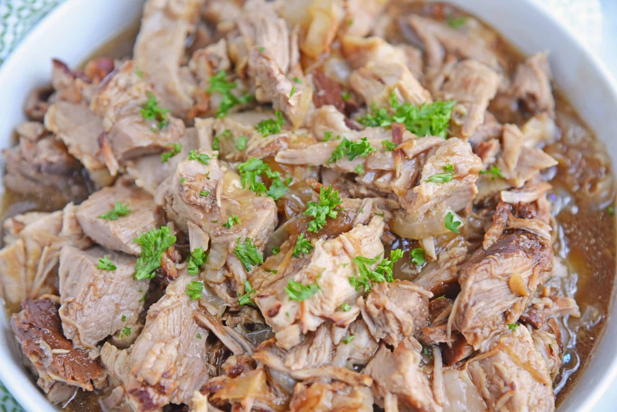 Close up of pulled pork in a honey balsamic sauce in a bowl