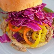 Close up of red cabbage slaw on sandwich