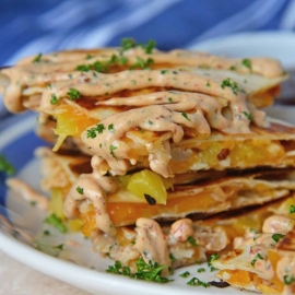 A close up of a plate of food, with Chicken and Quesadilla