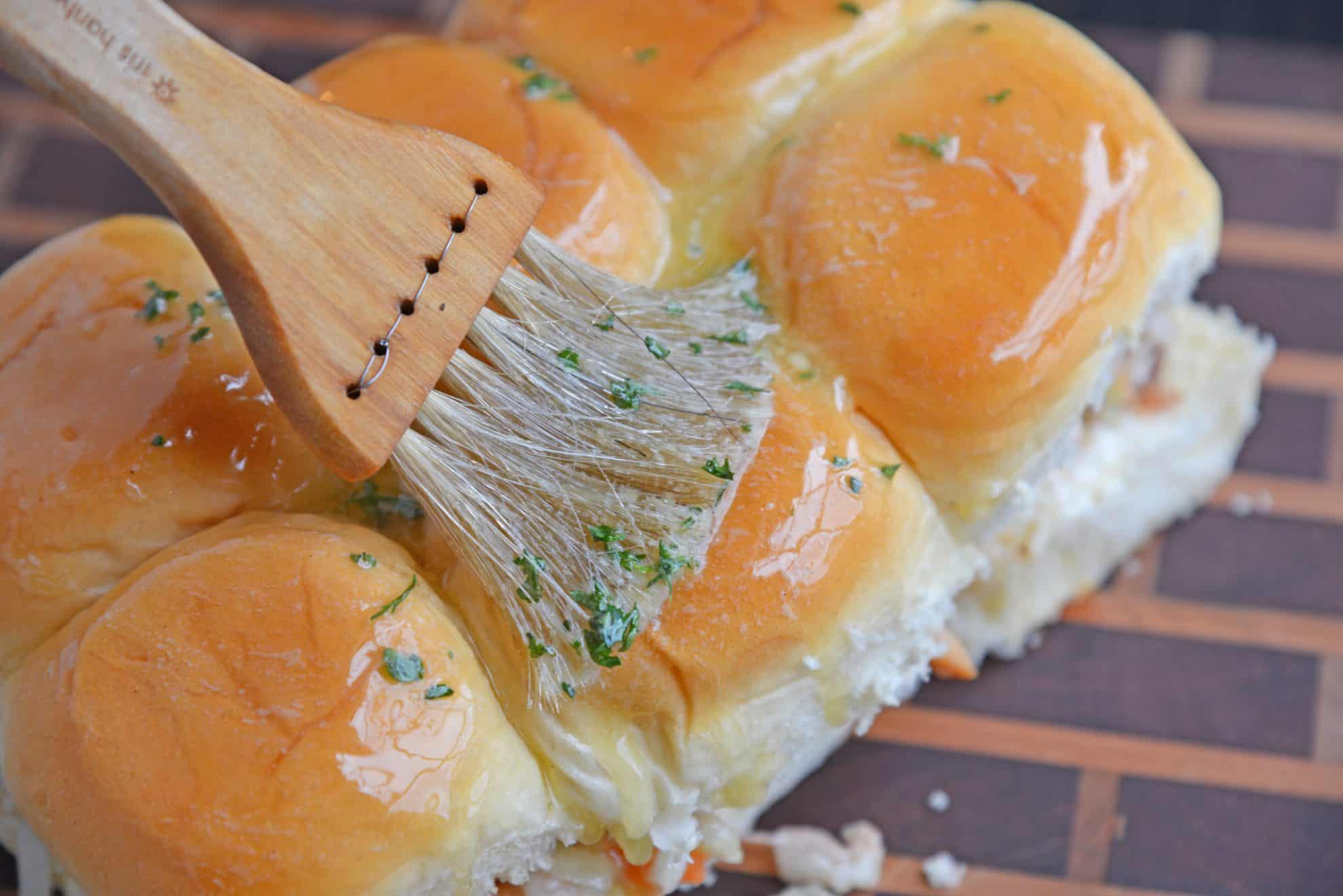 Butter basting onto slider rolls 