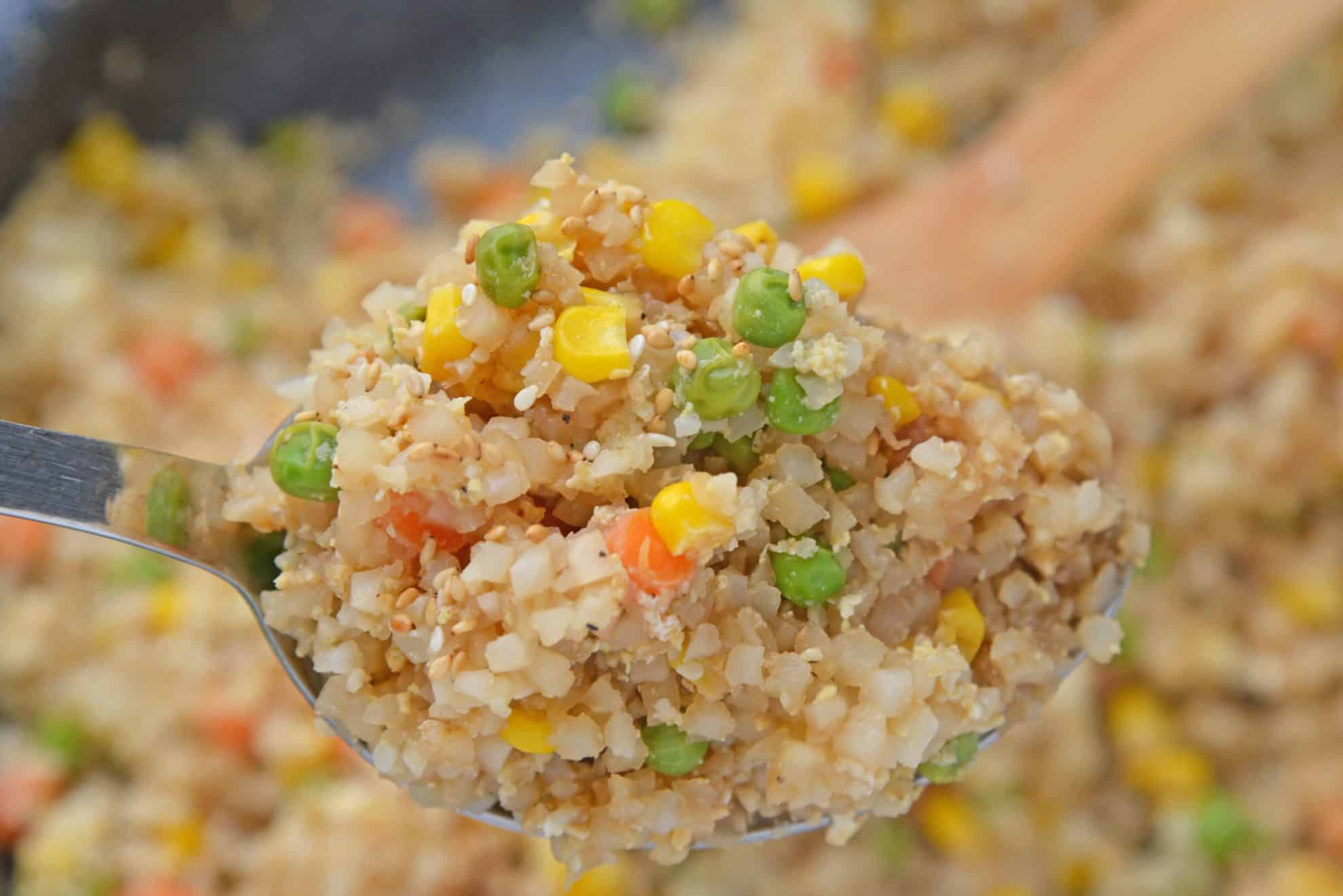 close up of cauliflower fried rice on a spoon