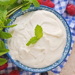 Overhead of cream cheese fruit dip with fresh fruit and mint