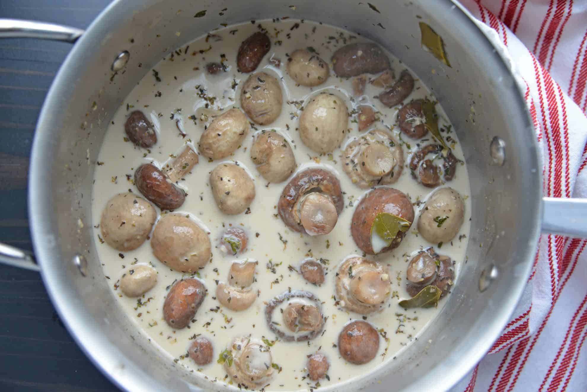 Creamy mushrooms in a sauce pot