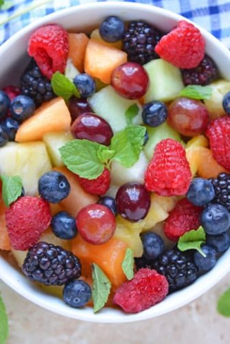 Overhead of fruit salad in white bowl