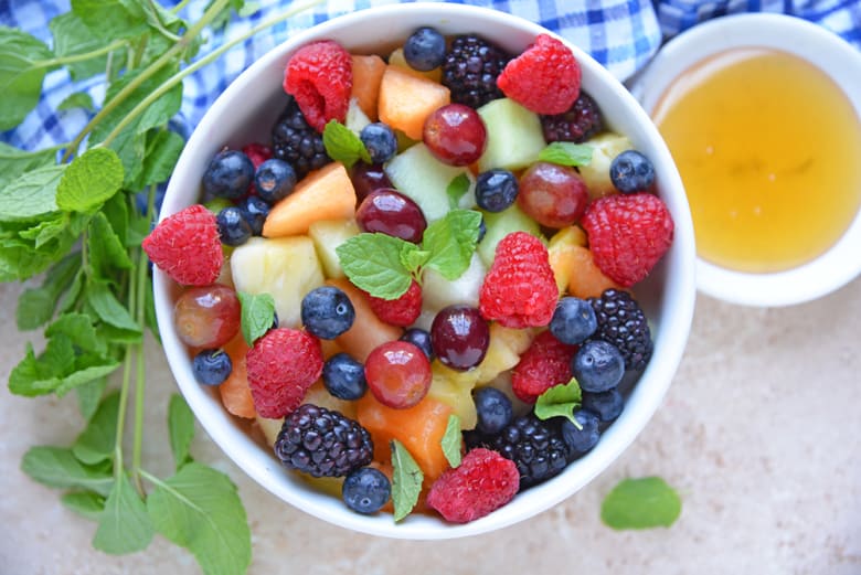 Overhead of fruit salad in white bowl