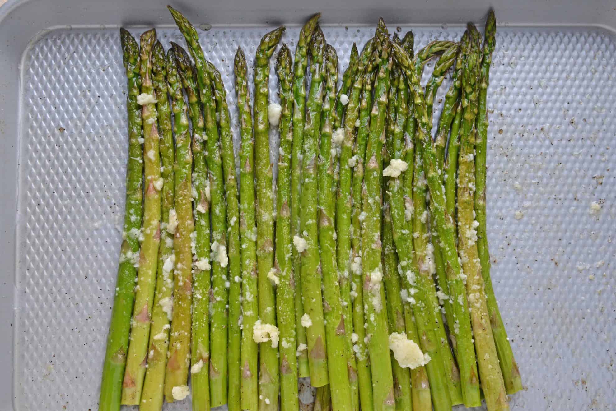 Garlic Parmesan Asparagus on a baking sheet