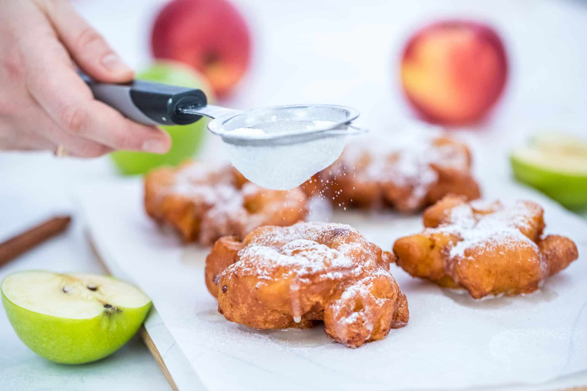 Powdered sugar sprinkling on fritters