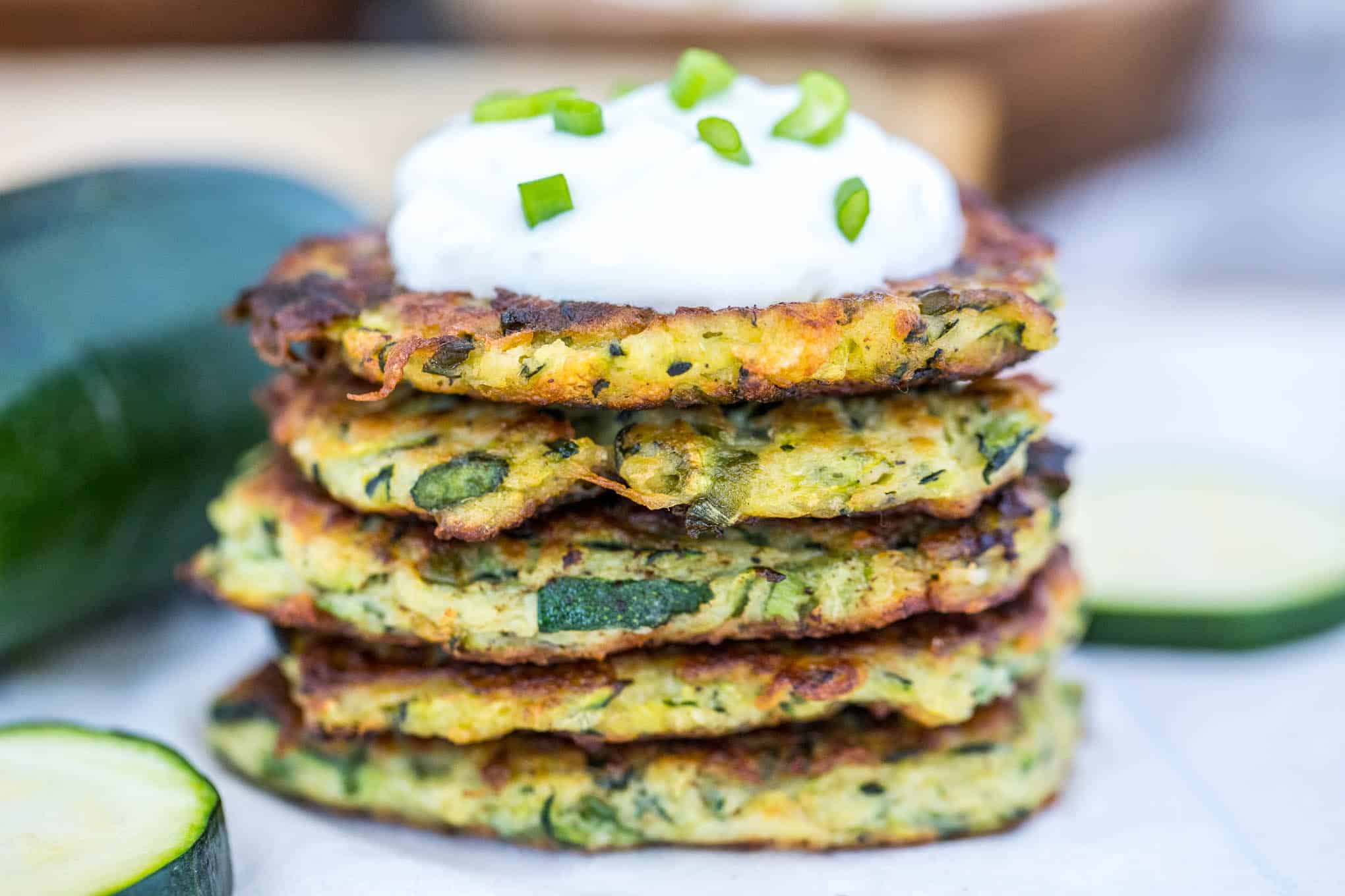 zucchini fritters with sour cream topping