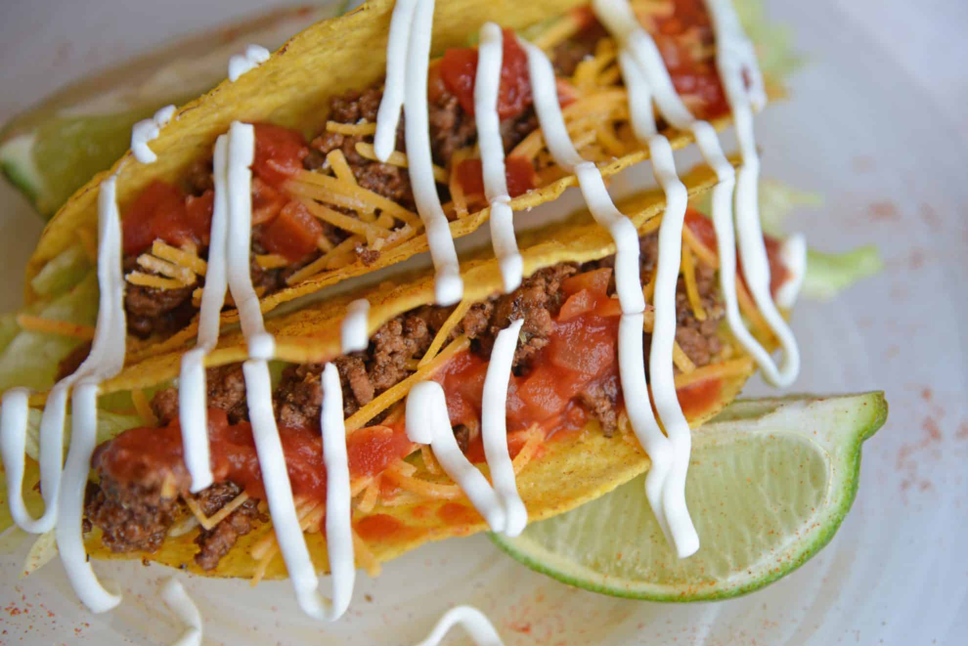 crunchy hard tacos with sour cream