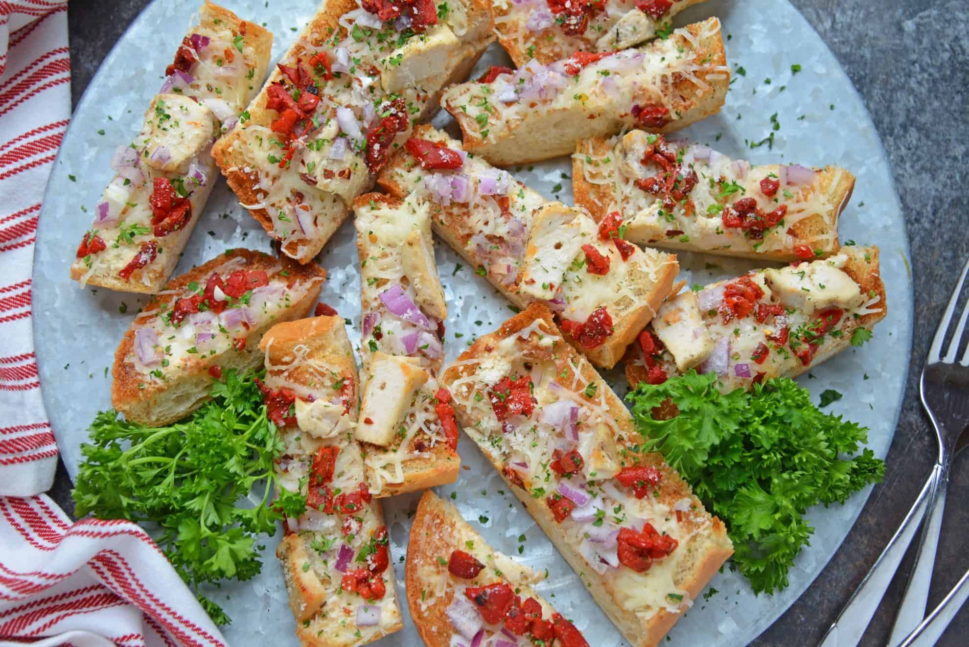 Alfredo Chicken French Bread Pizza on a serving platter