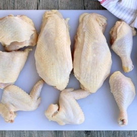 How to cut a whole chicken into individual cuts to save money.