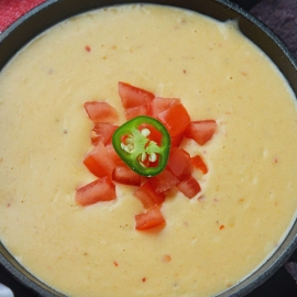 Close up of queso dip in a serving bowl