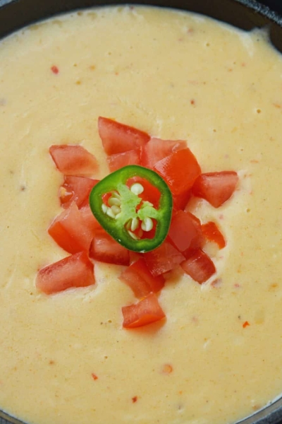 Close up of queso dip in a serving bowl