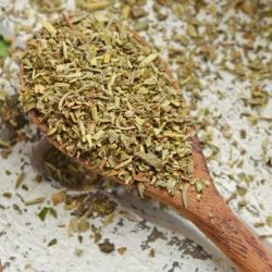 close up of italian spices in a wooden spoon