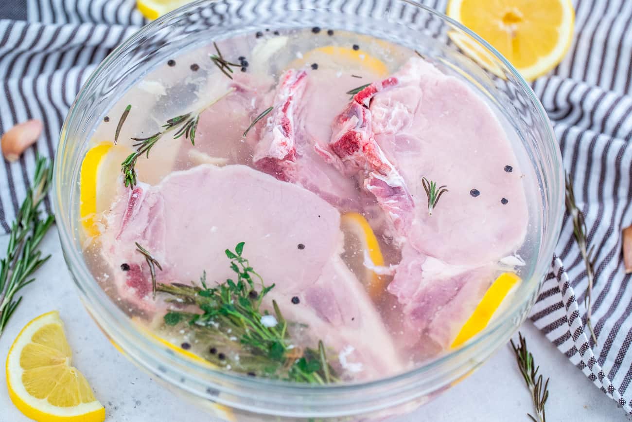 Pork chops in brining solution