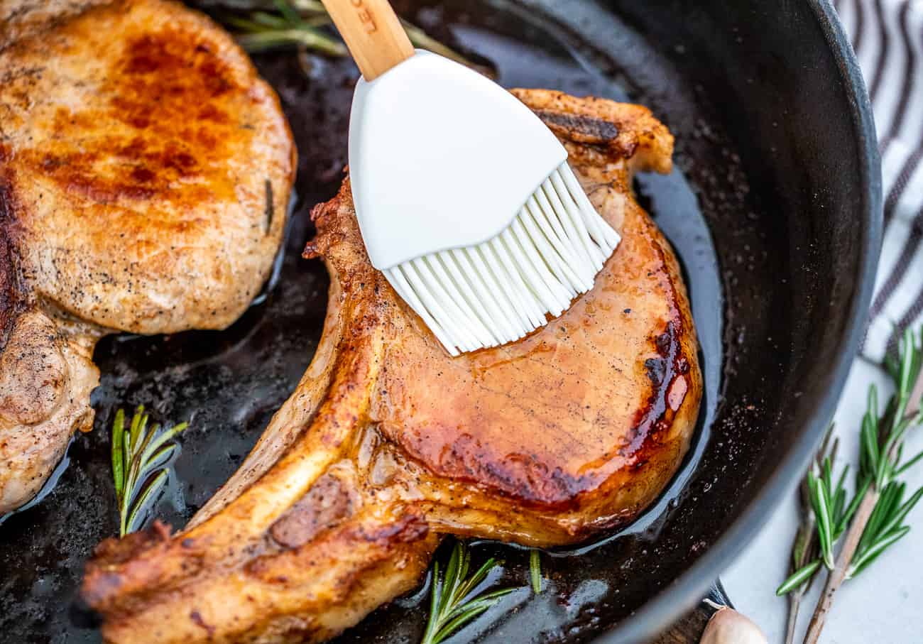 Pork chop being basted