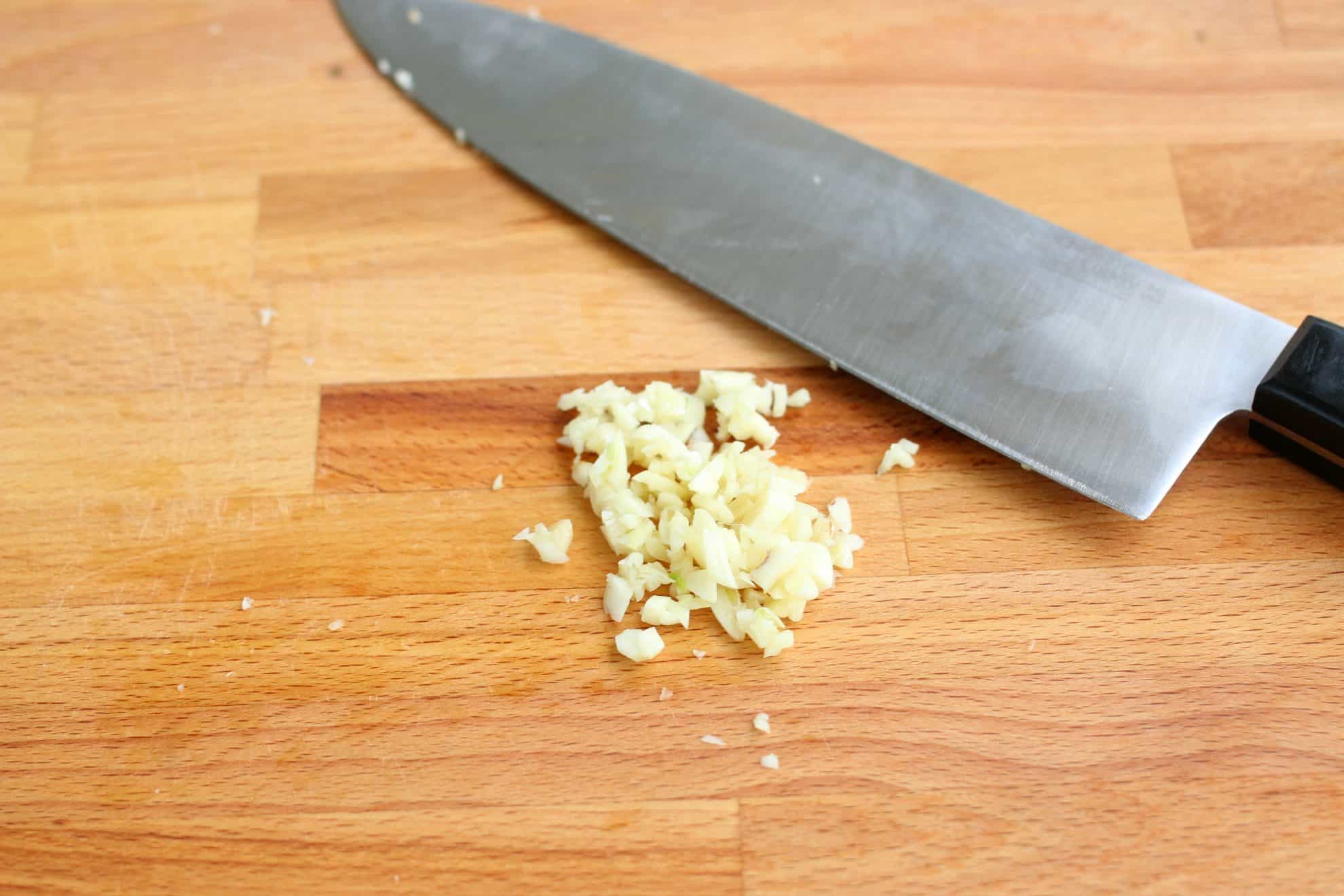 Chopped garlic on a cutting board