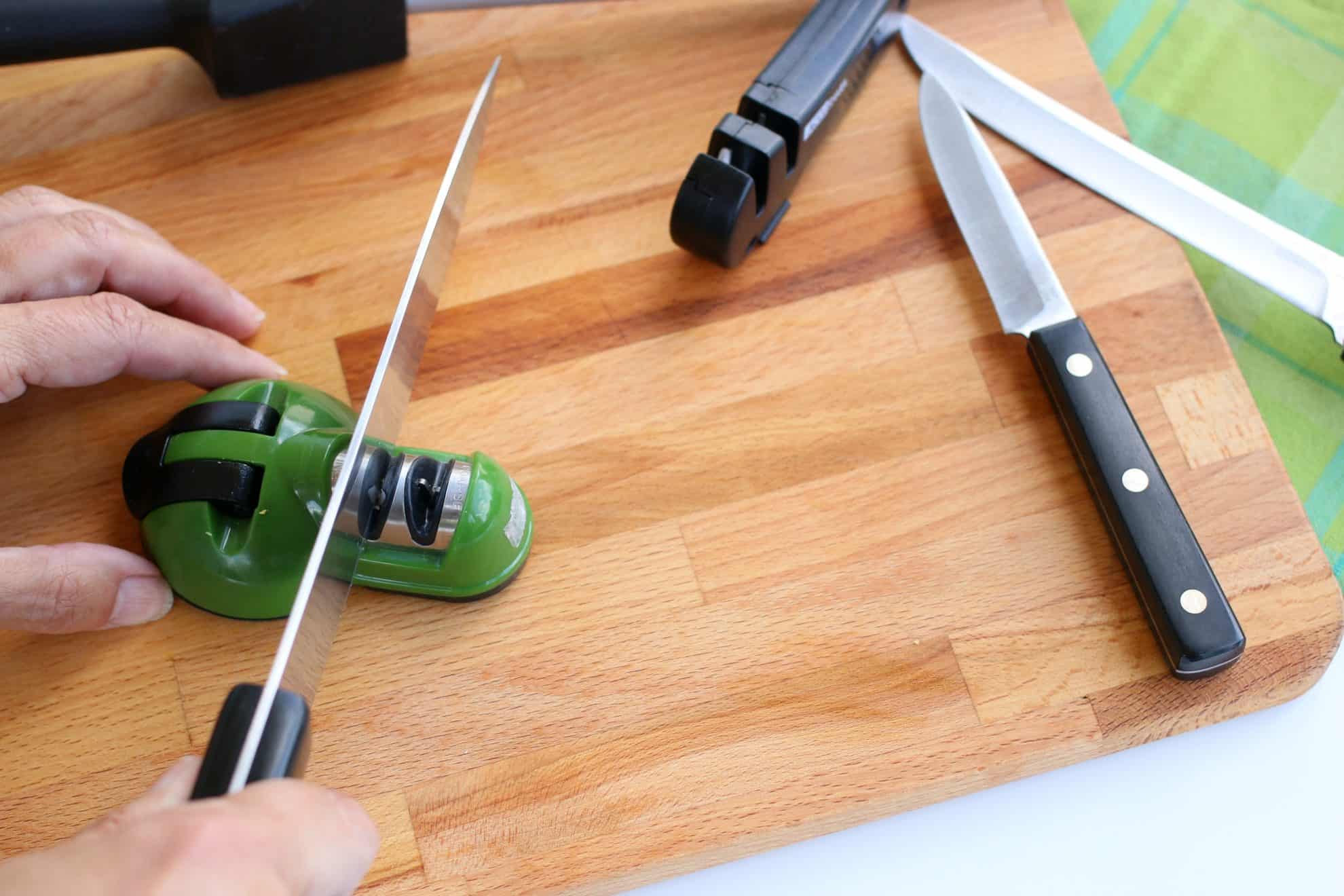 Sharpening a kitchen knife using a multi-function sharpener.