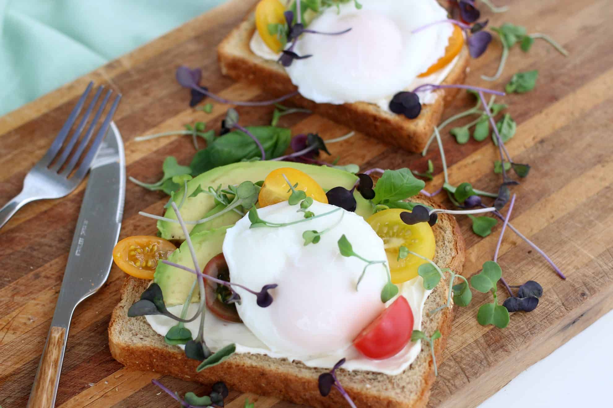 A plate of food with a knife, with Poached egg