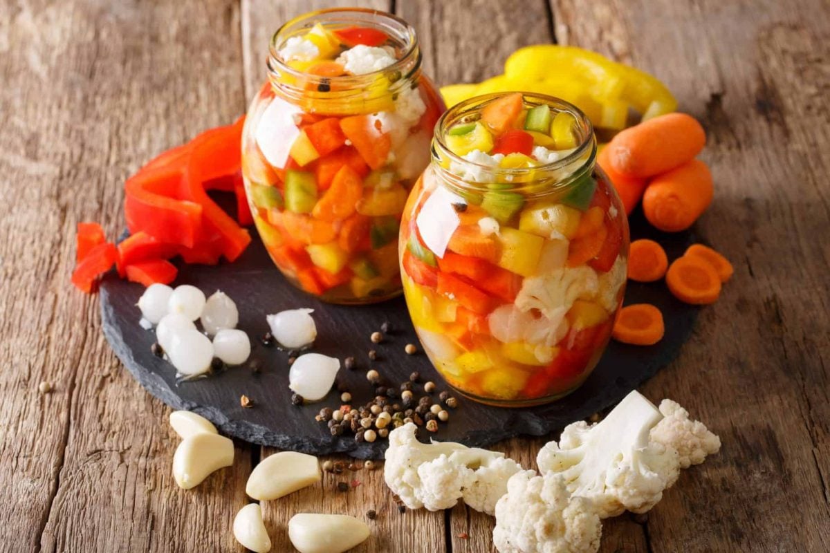 pickled vegetables on a wood counter